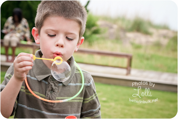 6 year old boy blowing bubbles