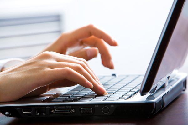 woman blogging at computer