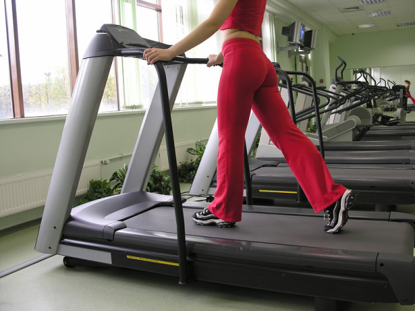 woman exercising on treadmill