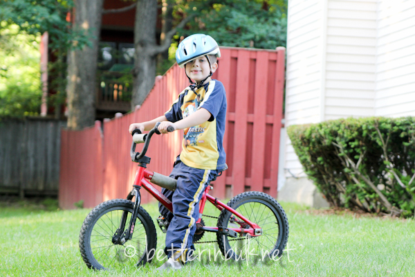 young boy on a bike