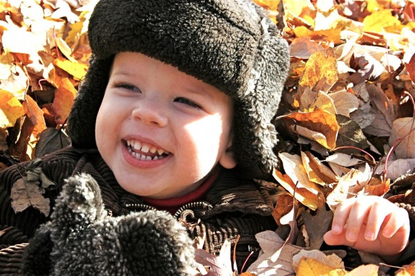 baby boy in fall leaves