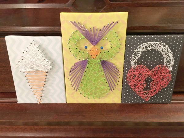 Finished string art kit projects.