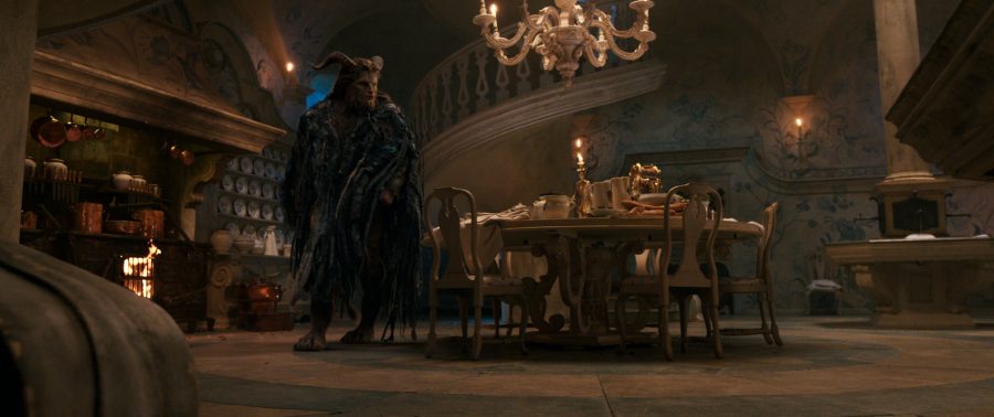 The Beast (Dan Stevens) with Lumiere the candelabra and Cogsworth the mantel clock in the castle kitchen in Disney's BEAUTY AND THE BEAST, a live-action adaptation of the studio's animated classic which is a celebration of one of the most beloved stories ever told.